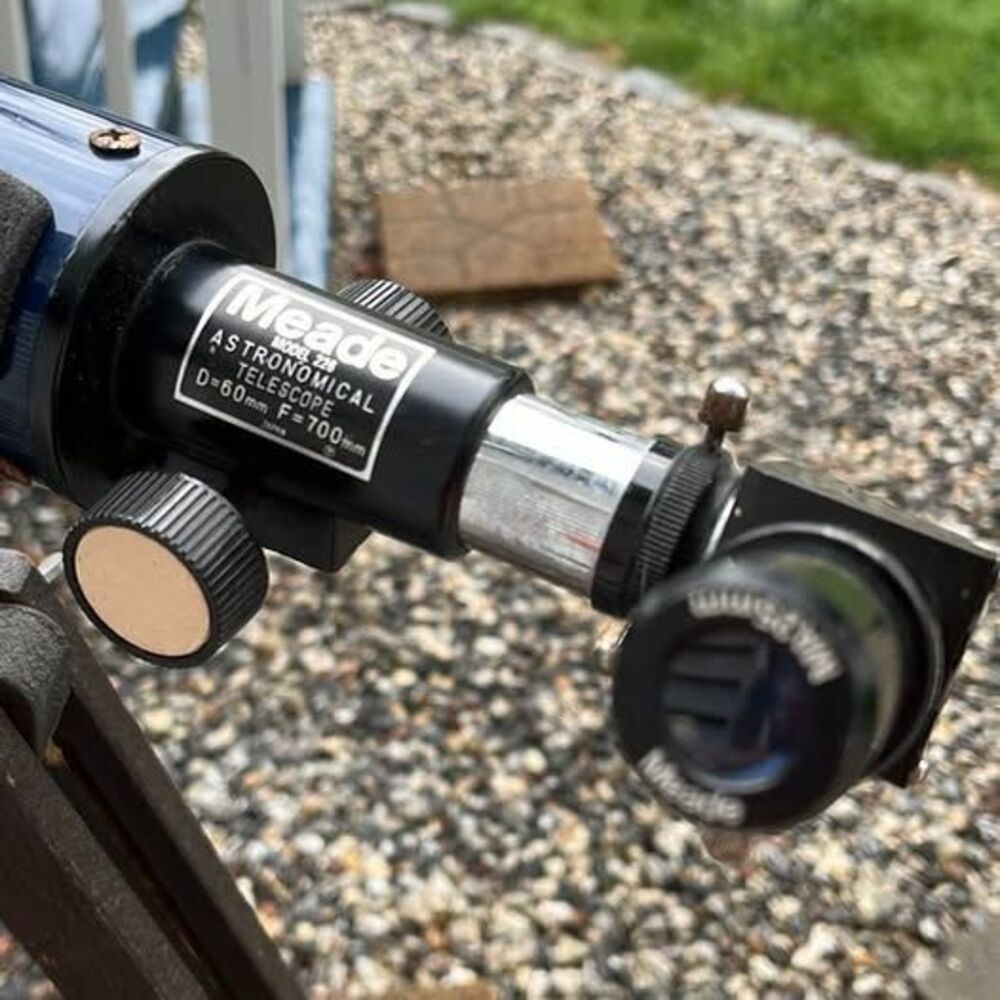 Meade an antique stand and telescope ￼